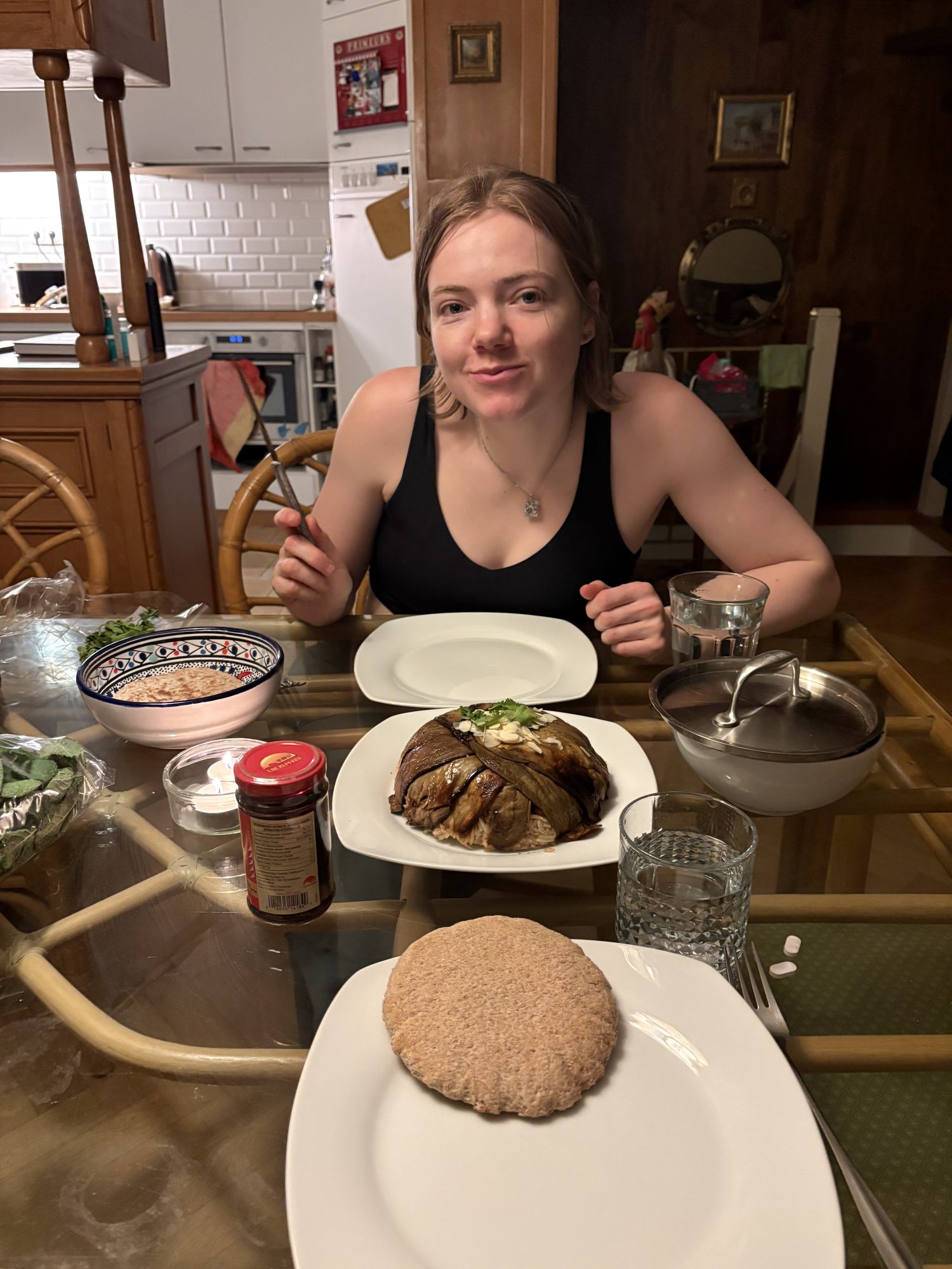 Marin with handmade ceramic bowls and plates at the dinner table